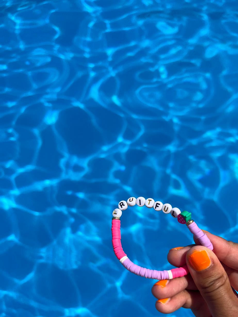 FRUITFUL slogan bracelet in pink/ lilac