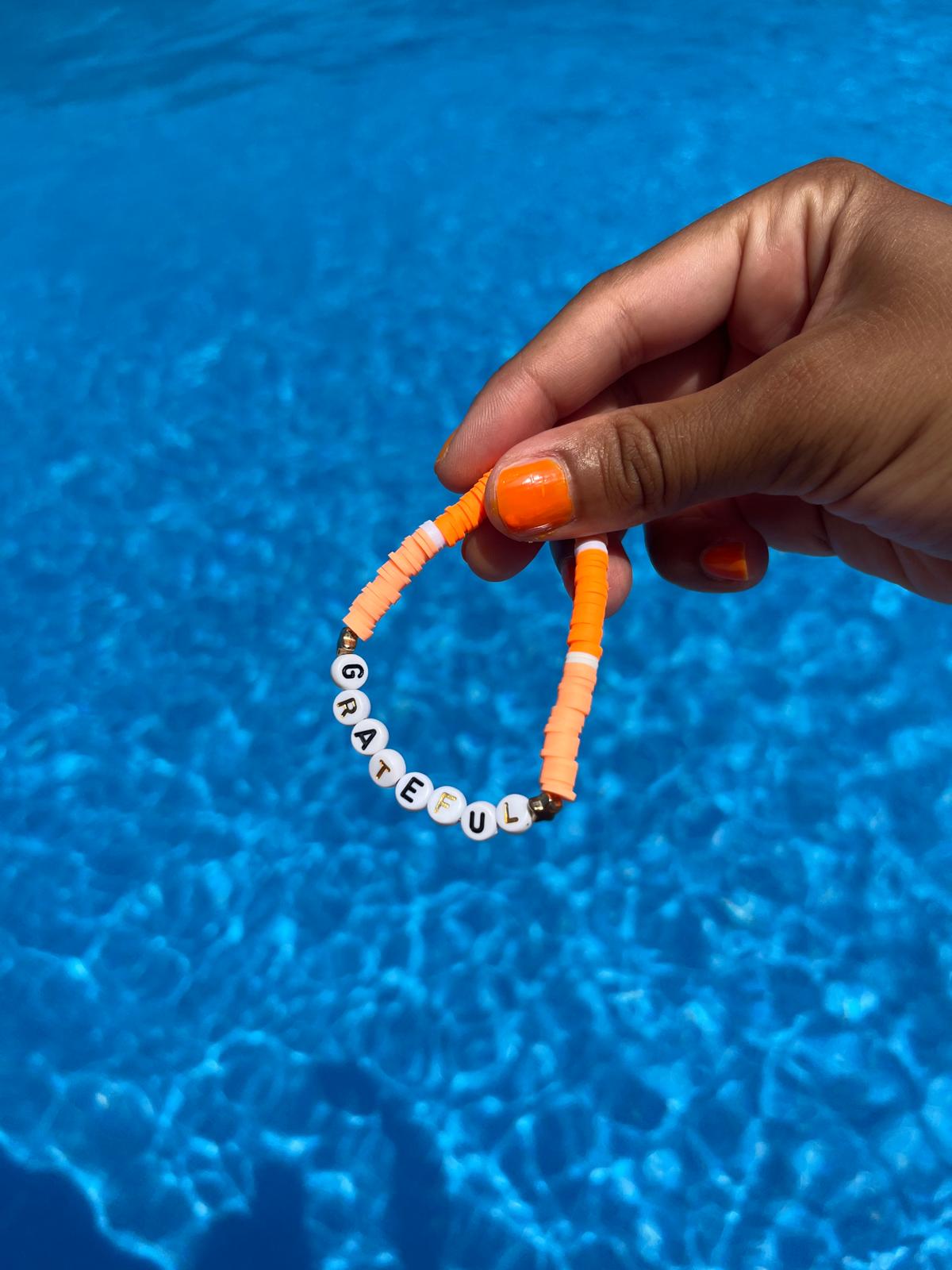 GRATEFUL slogan bracelet in orange