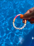 MASTERPIECE slogan bracelet in orange/ pink