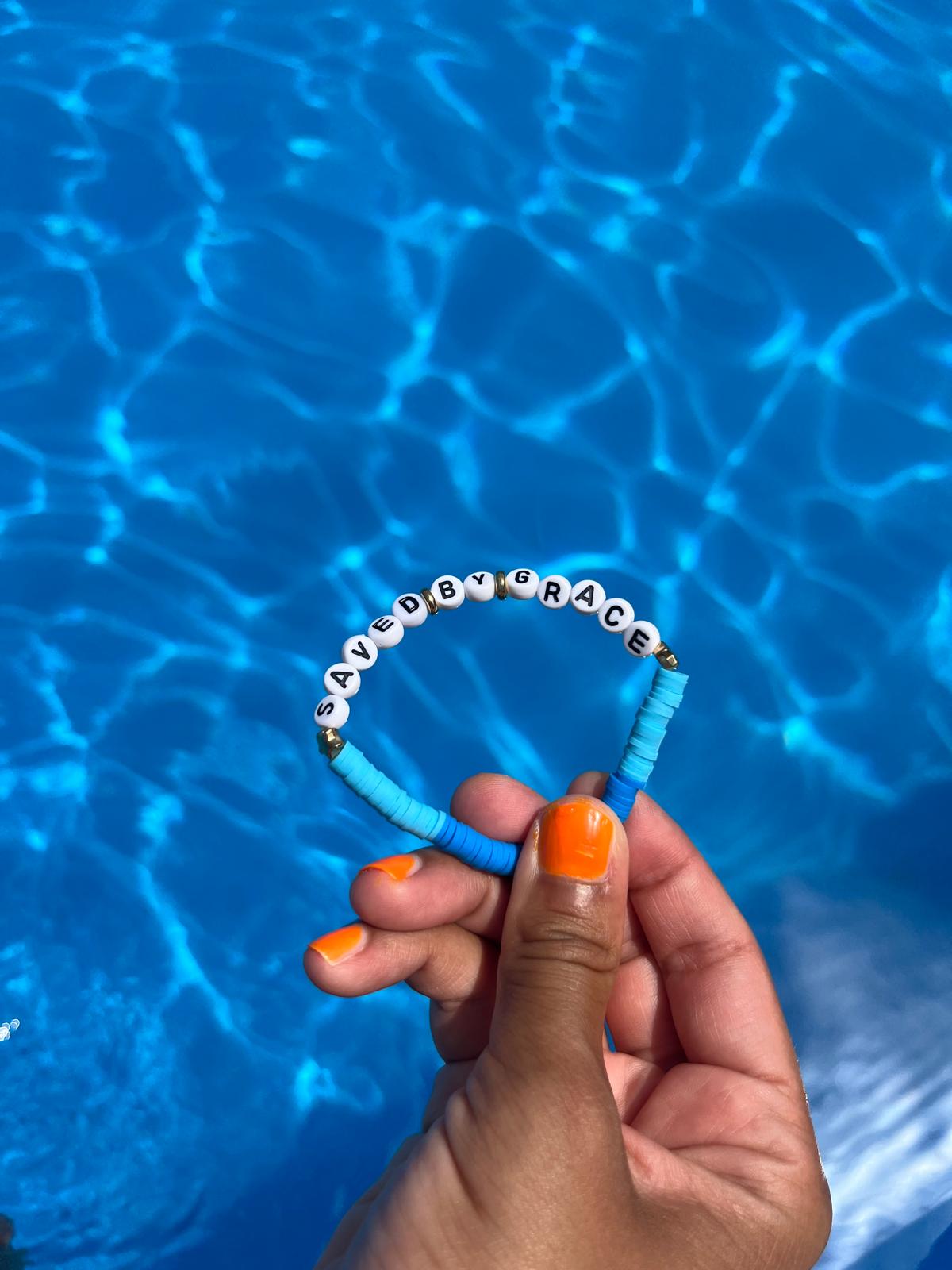 SAVED BY GRACE slogan bracelet in blue