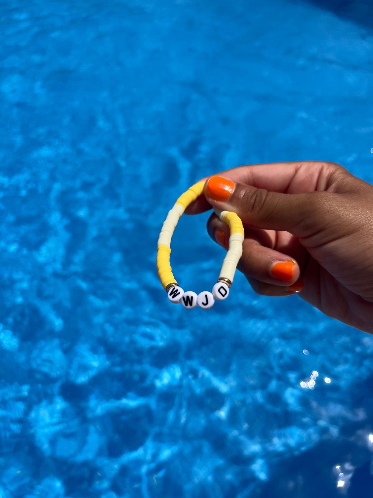 WWJD slogan bracelet in yellow